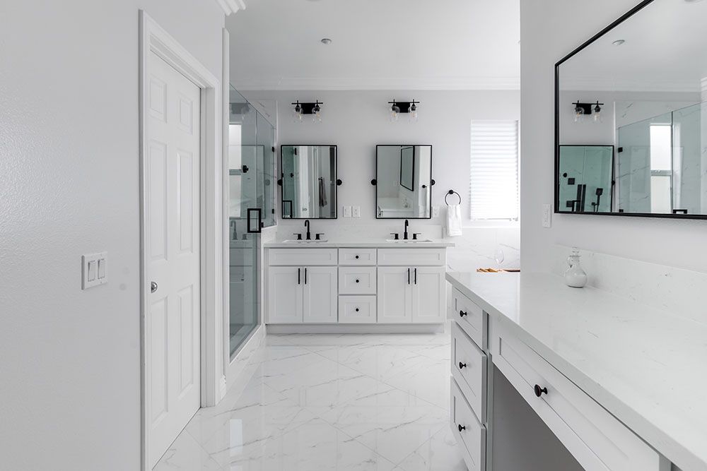 White bathroom with vanity mirror