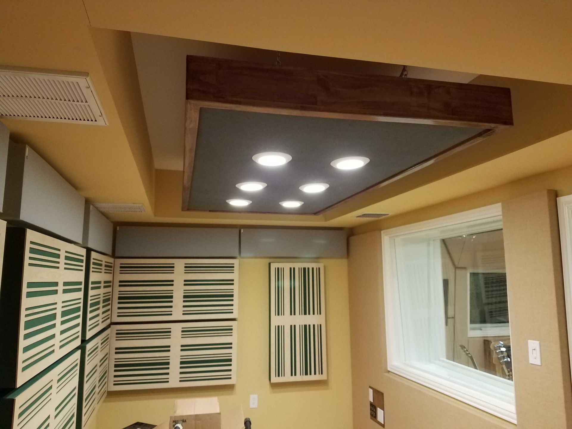 A room with a ceiling that has a lot of lights on it