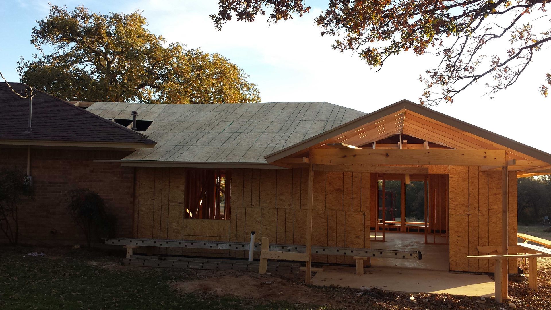 A house that is being built with a porch
