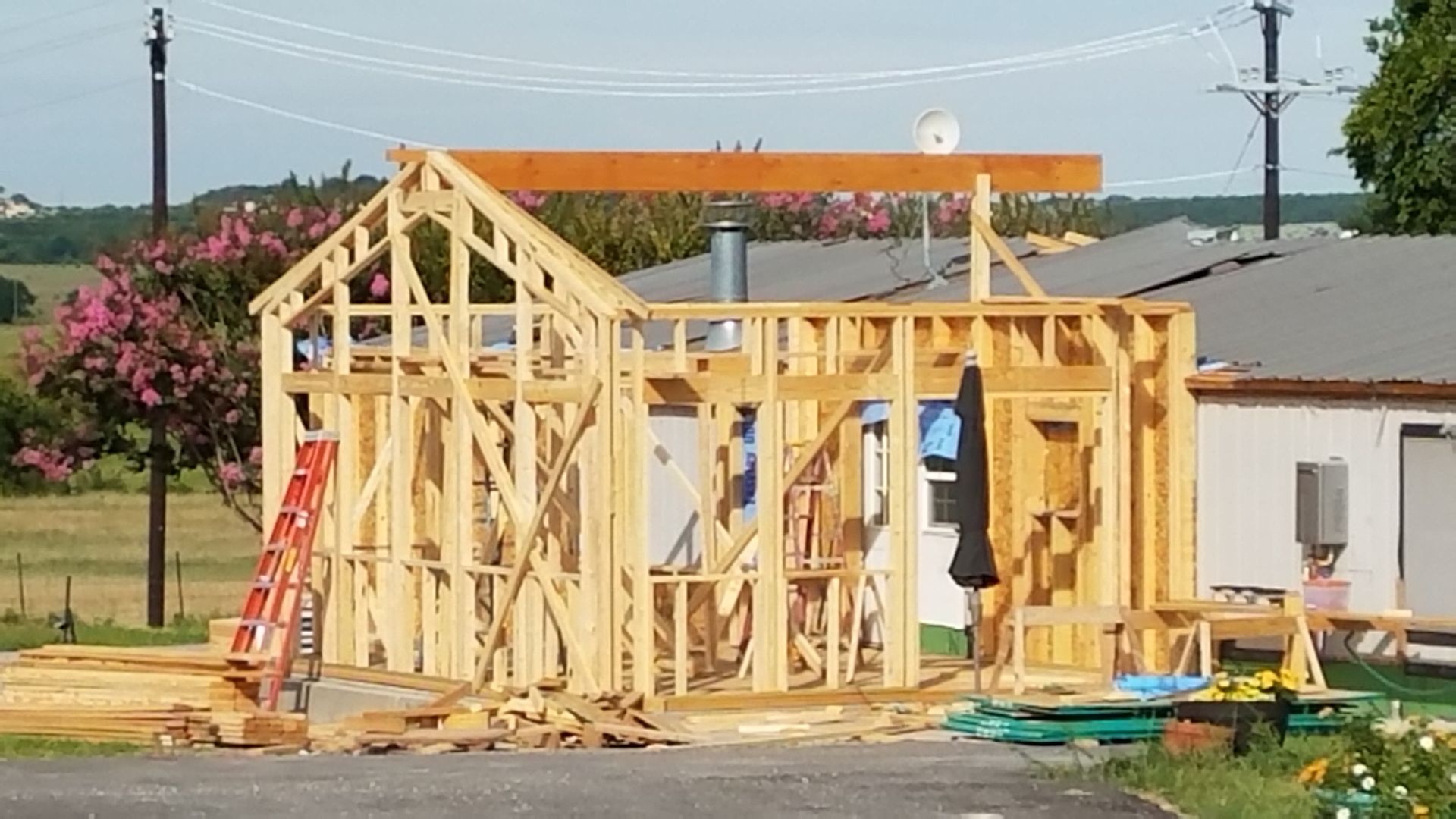 A house is being built with a wooden frame.