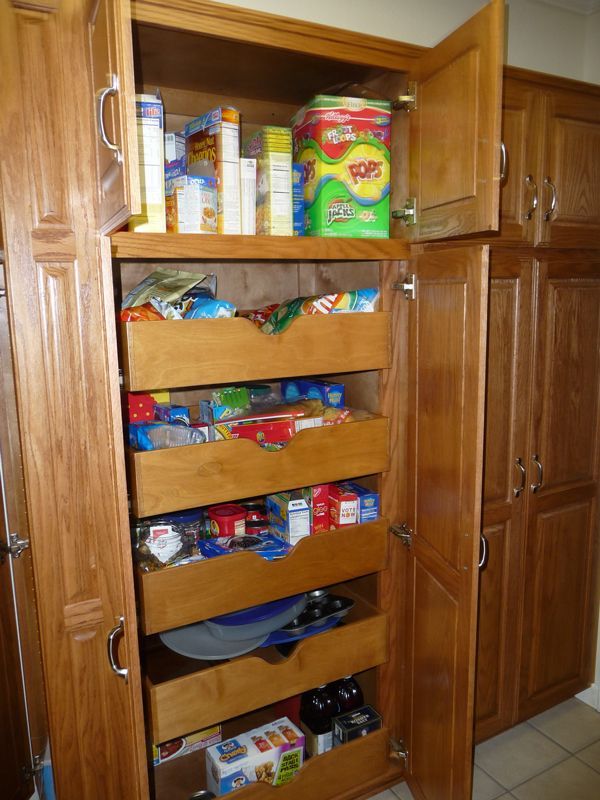 A pantry filled with lots of food including a box of tide