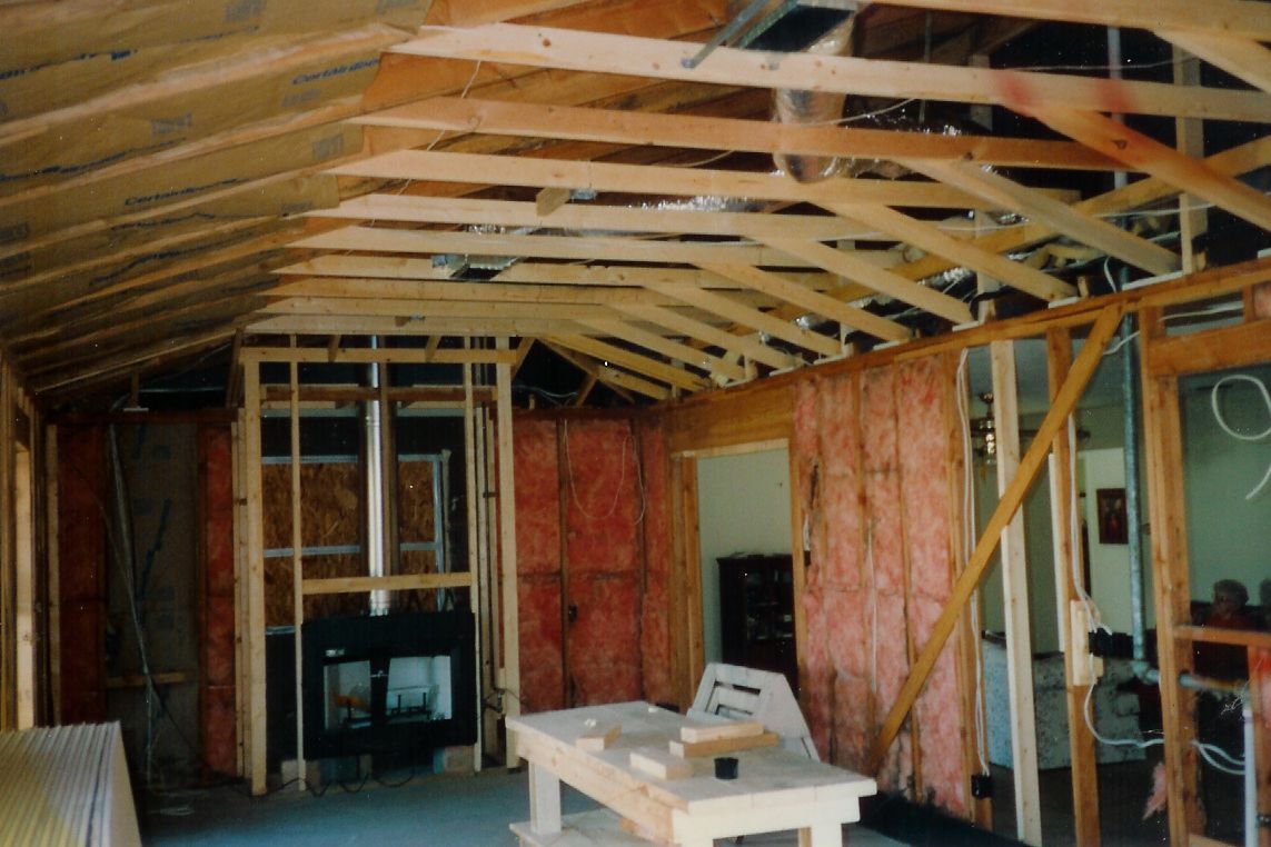A room under construction with a table in the middle
