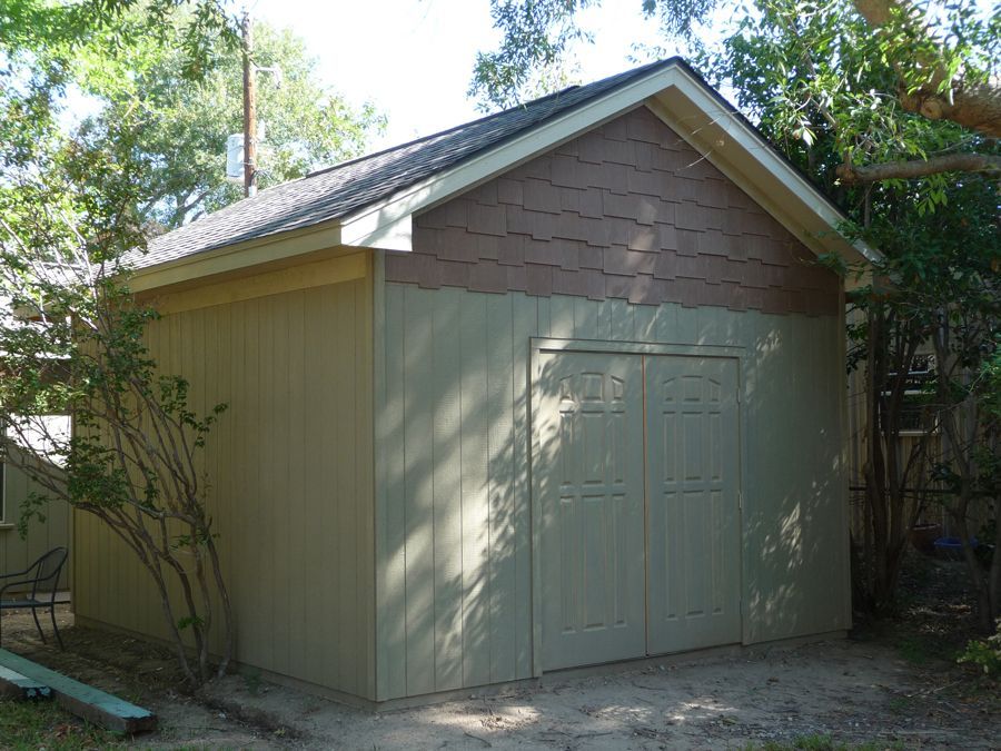 A garage with a roof that has shingles on it