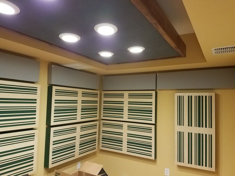 A room with a ceiling that has a lot of lights on it