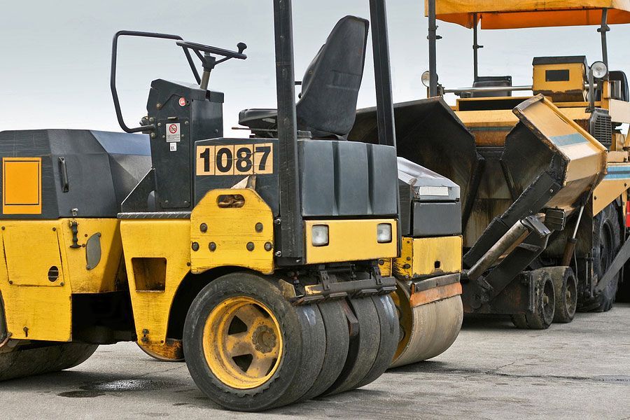 A yellow and black machine with the number 1087 on it