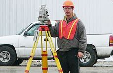 Man using a surveyor tool