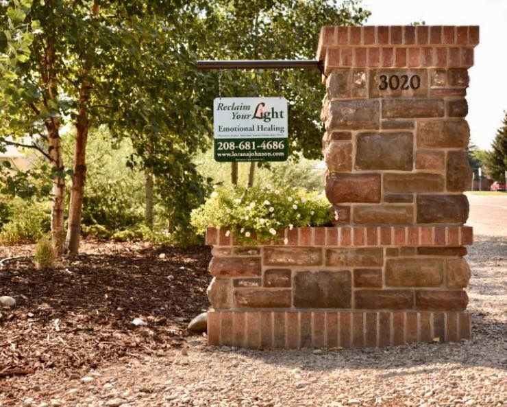 Stone entrance pillar with sign for 