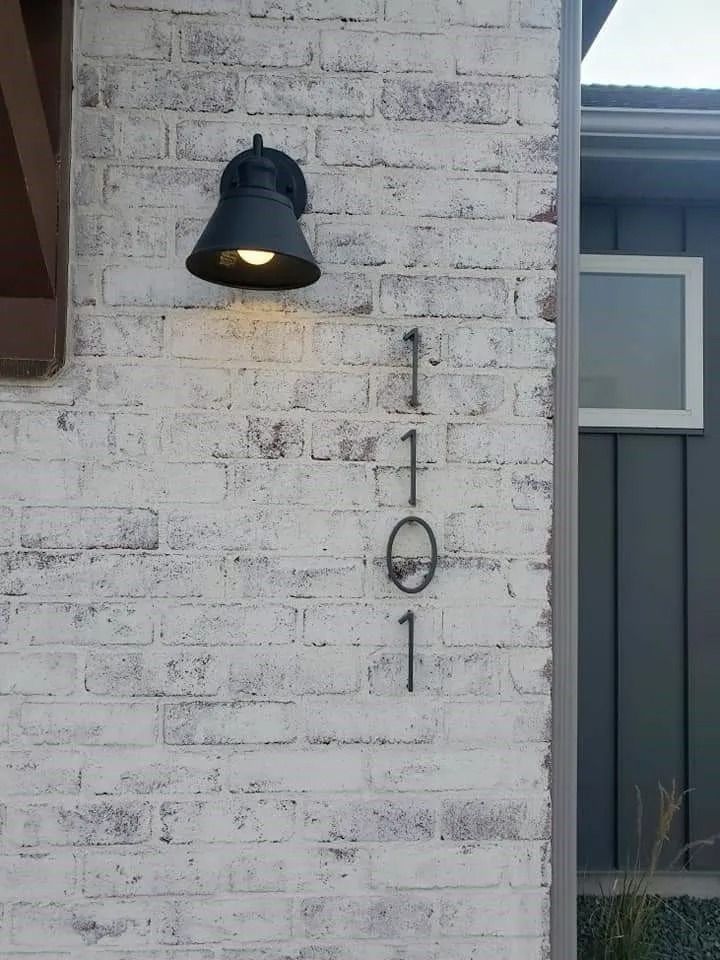 Exterior brick wall with house number 