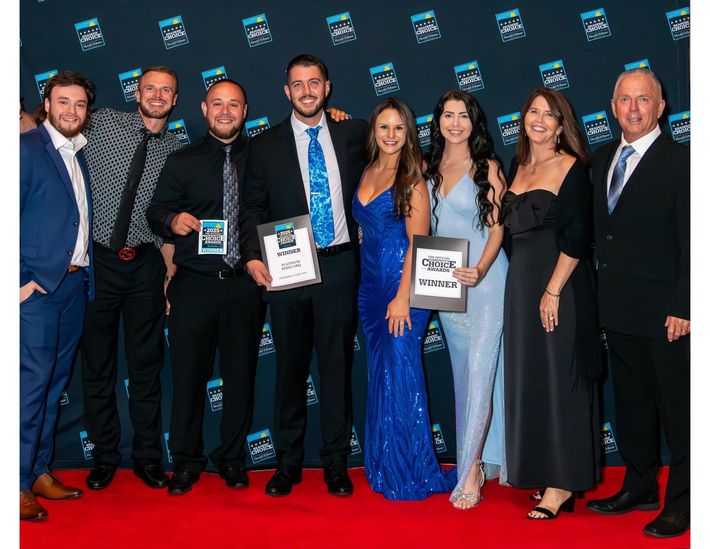 A group of people are posing for a picture together.