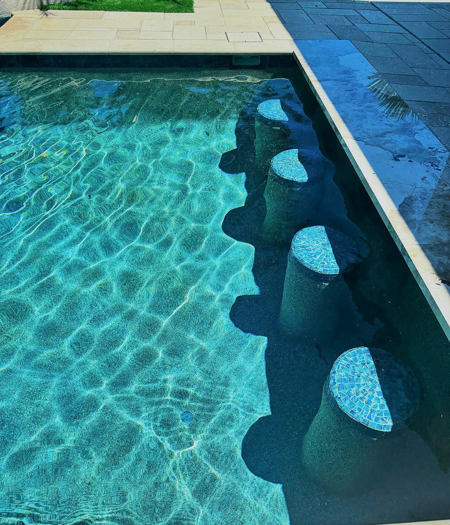 A swimming pool with a lot of blue water