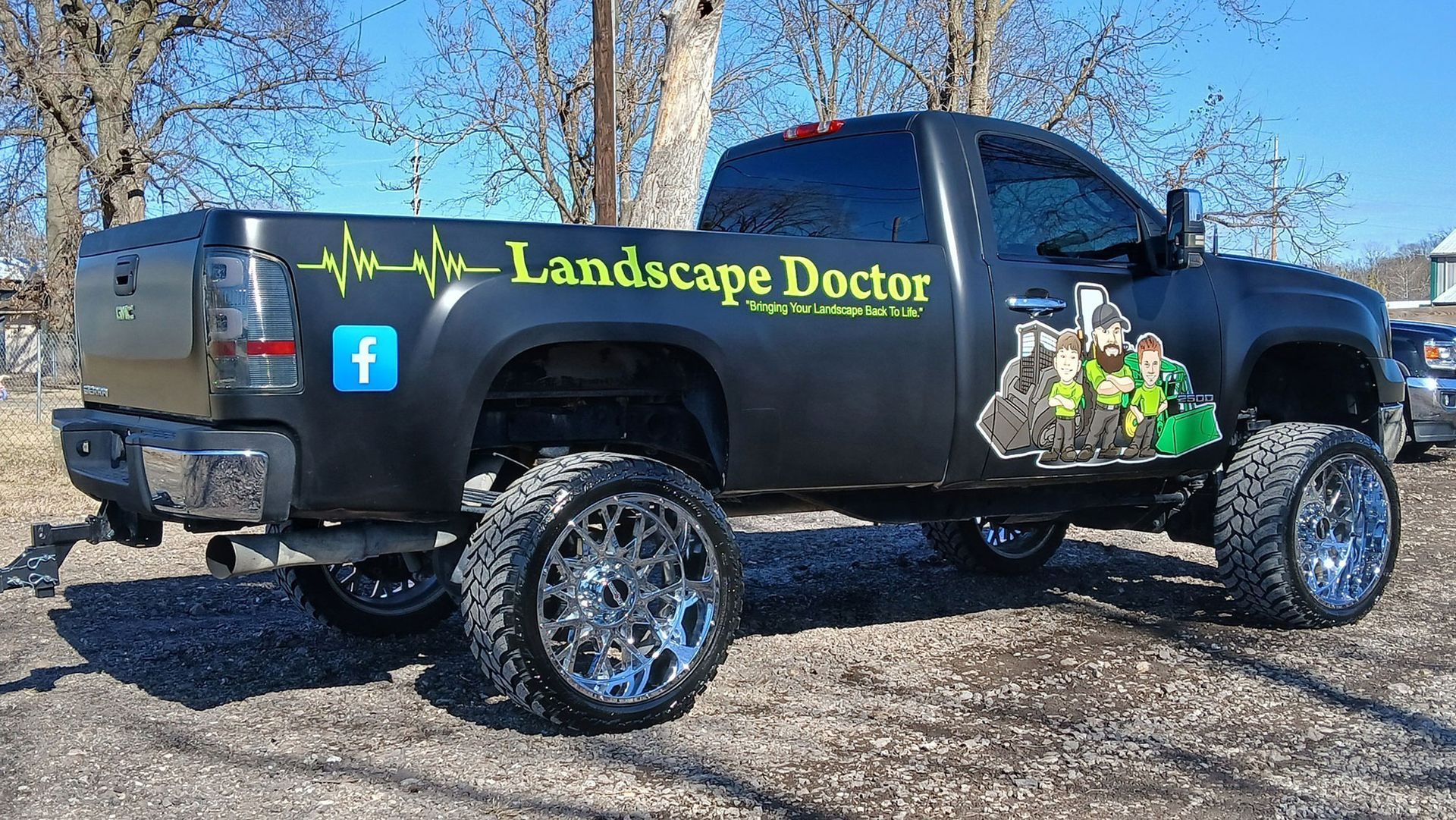 A fire pit is surrounded by chairs on a stone patio.