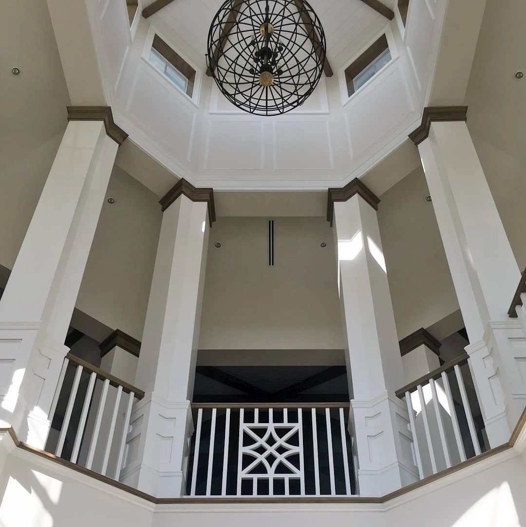 The inside of a building with a chandelier hanging from the ceiling