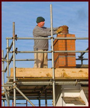 Chimney cap being installed
