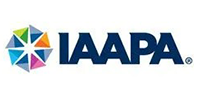 IAAPA logo with a colorful starburst graphic and dark blue text.