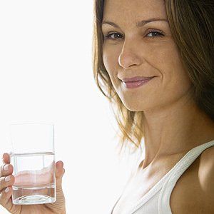 Woman with glass of water