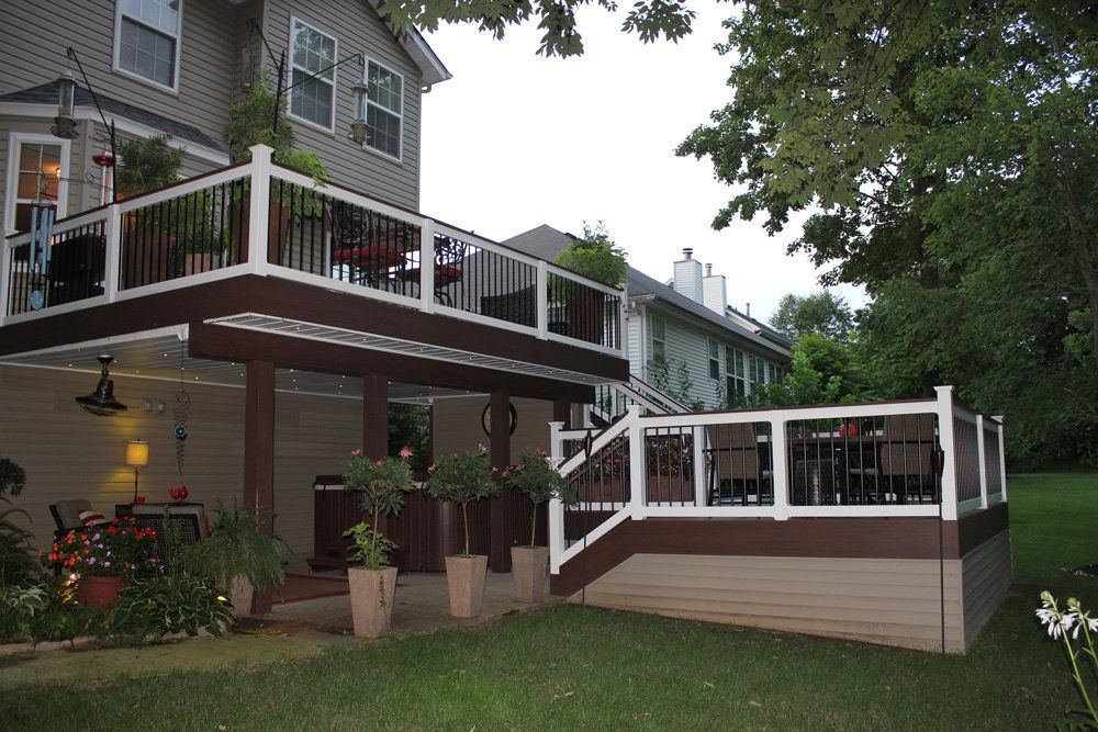 A house with a large deck in the backyard