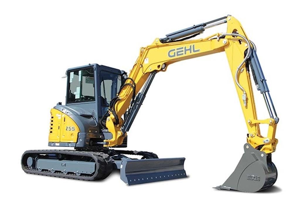 Yellow and gray Gehl excavator with bucket and blade, on a white background.