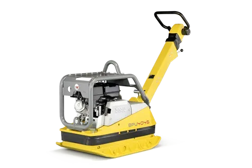 Yellow and gray plate compactor on a white background.