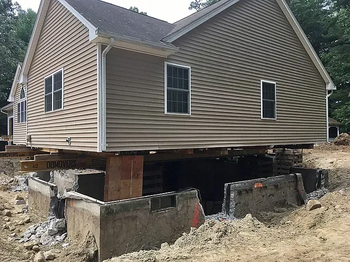 House lifted on temporary supports during foundation repair