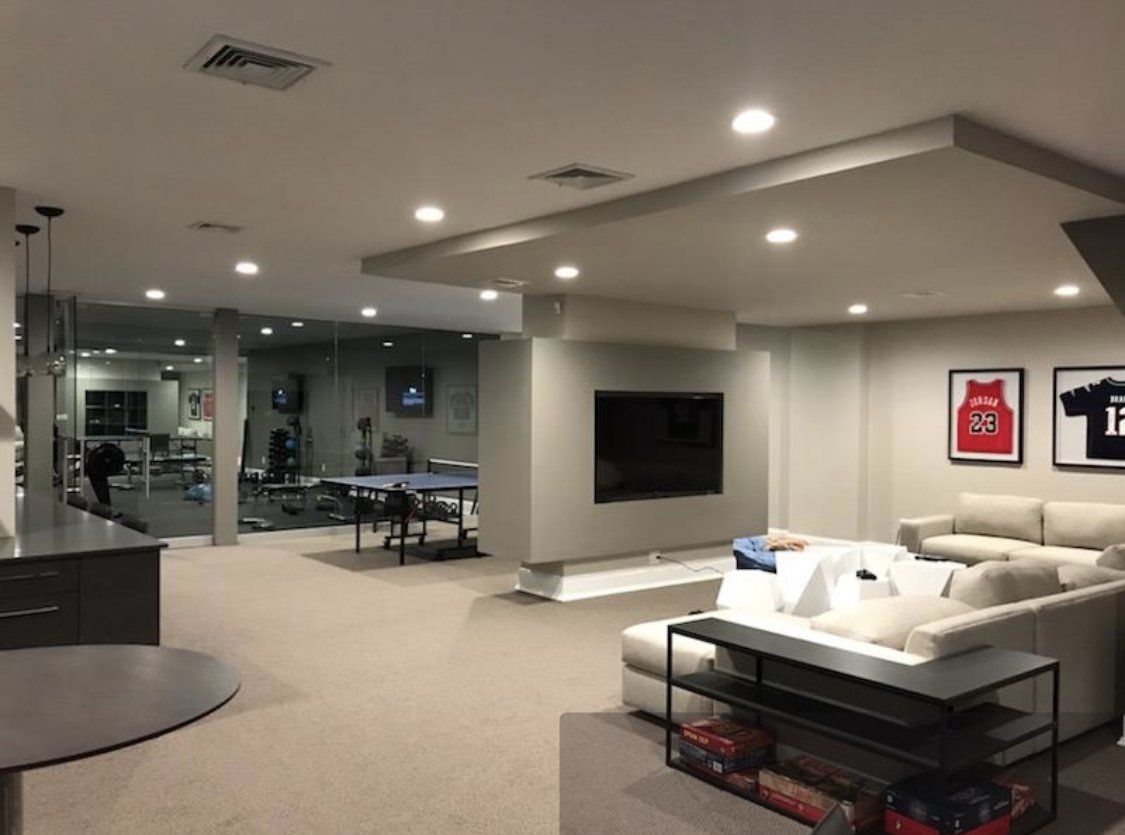 A living room with a couch and a television