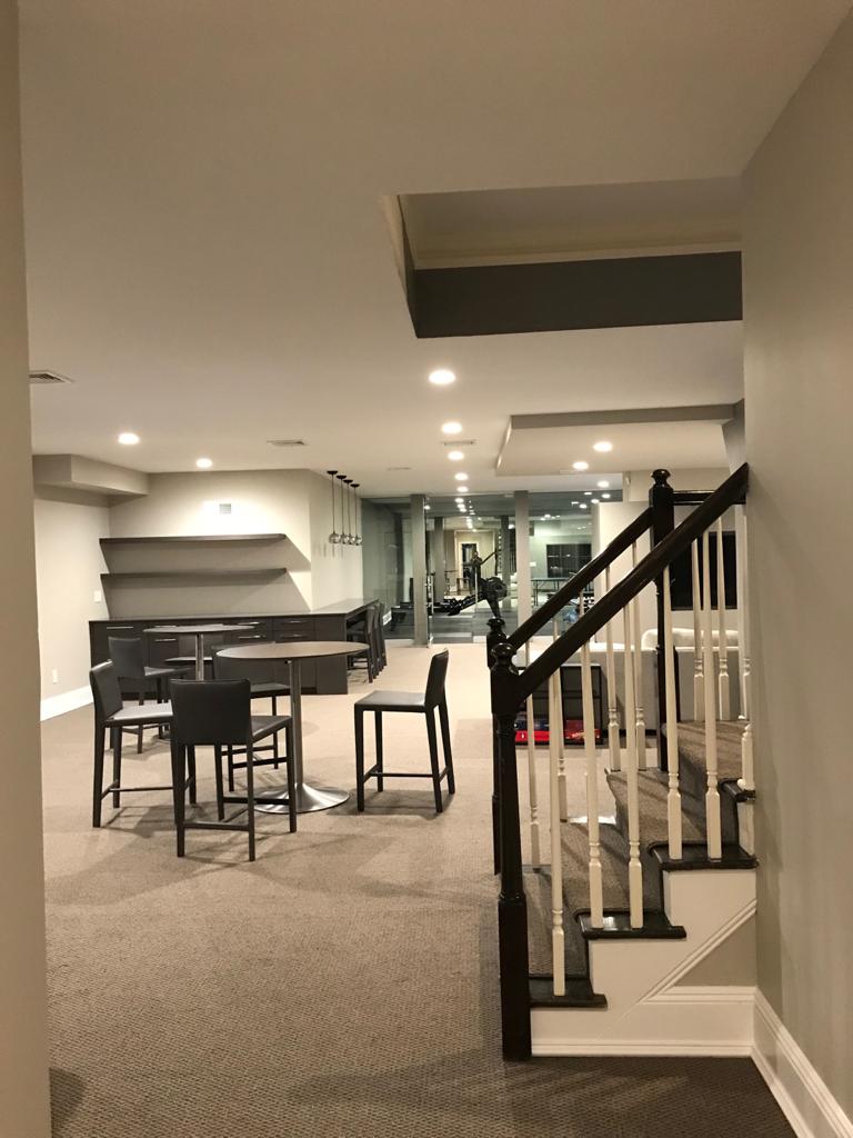 A basement with a staircase leading up to the second floor.