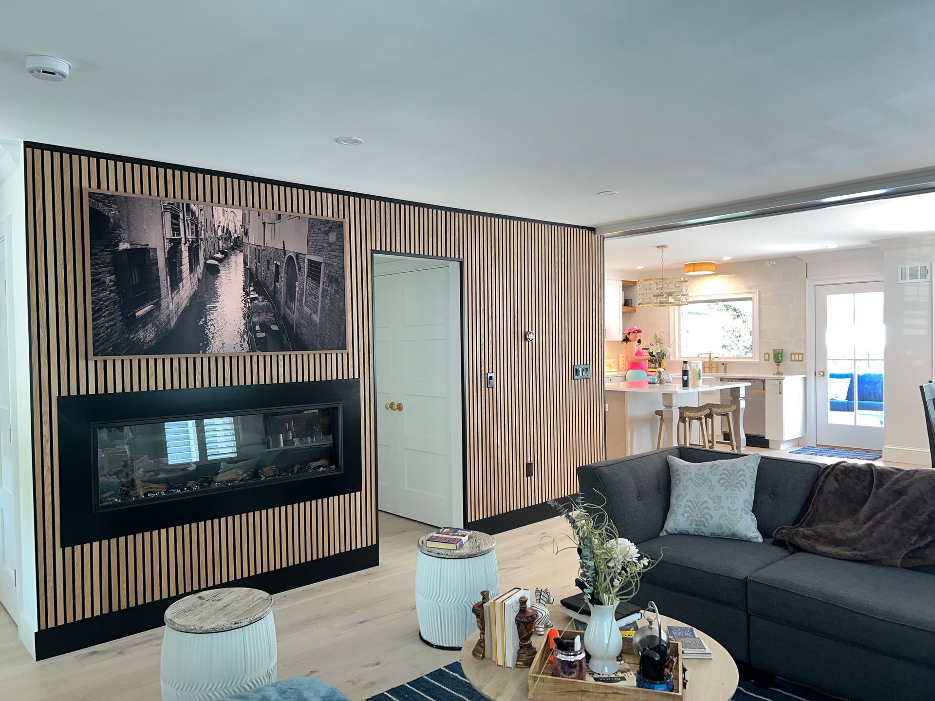 A living room with a couch and a fireplace.