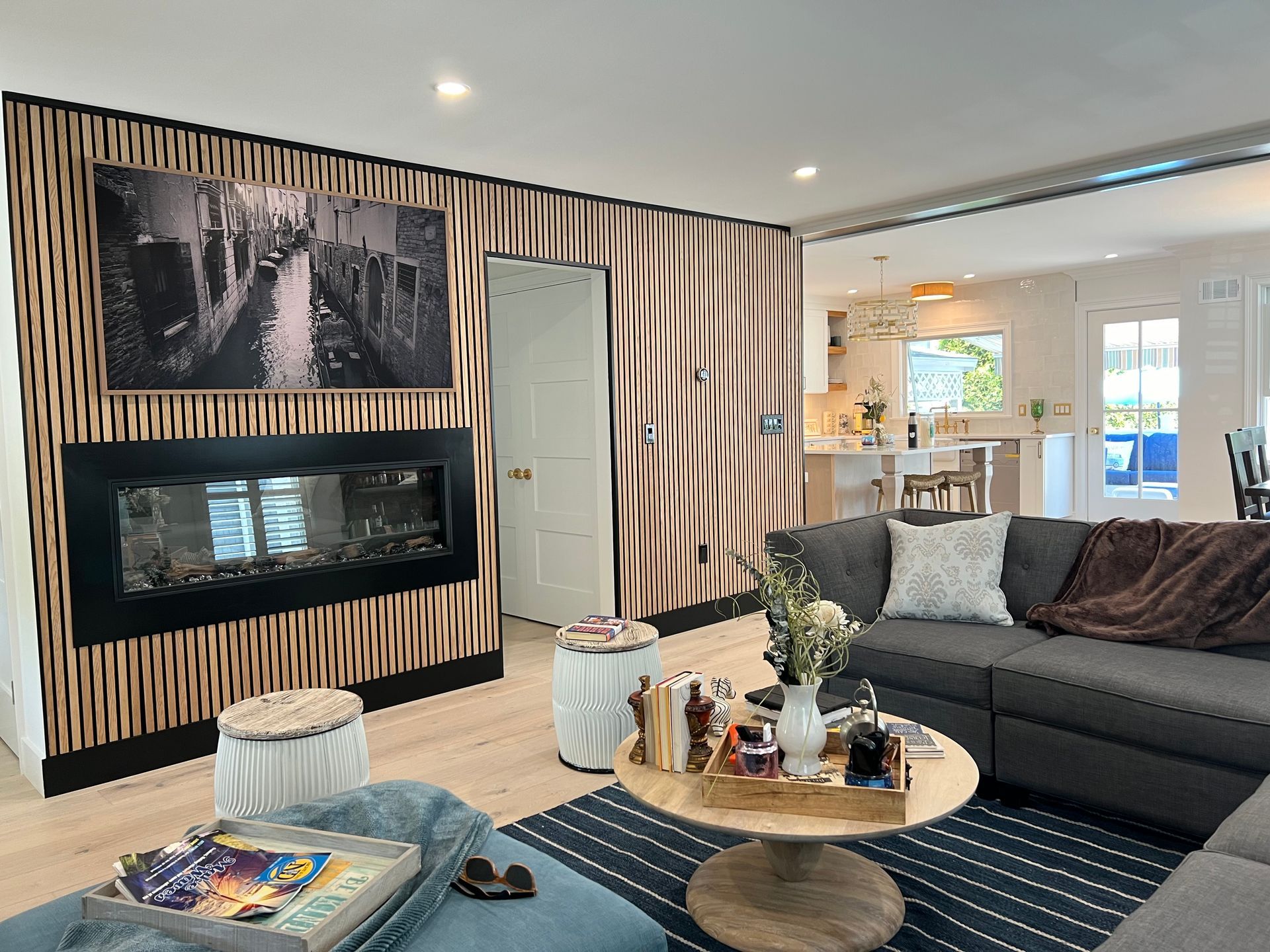 A living room with a couch , coffee table , and fireplace.