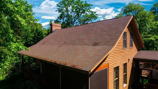 Soft washing a roof from algae, lichen, moss & mould - Benz