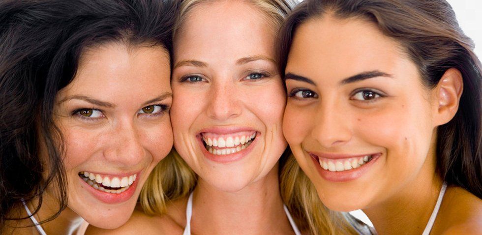 Three women smiling