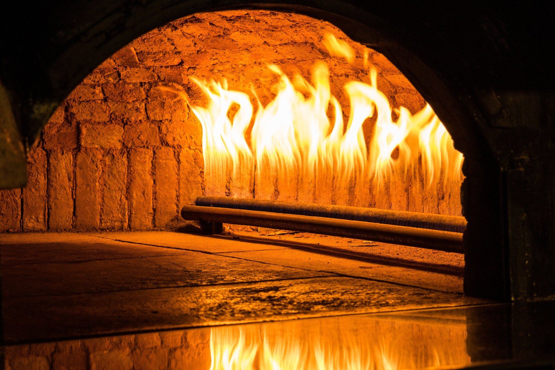 a brick oven with flames coming out of it