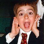 A desk with a computer and a sign that says familyography