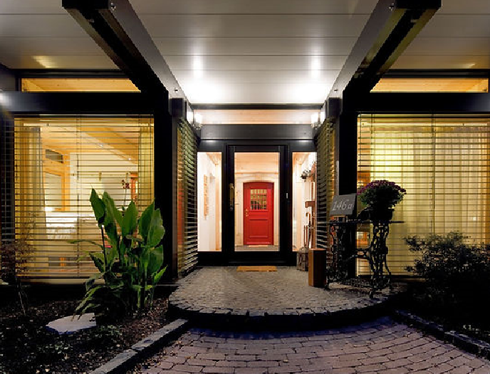 The front door of a house with a red door