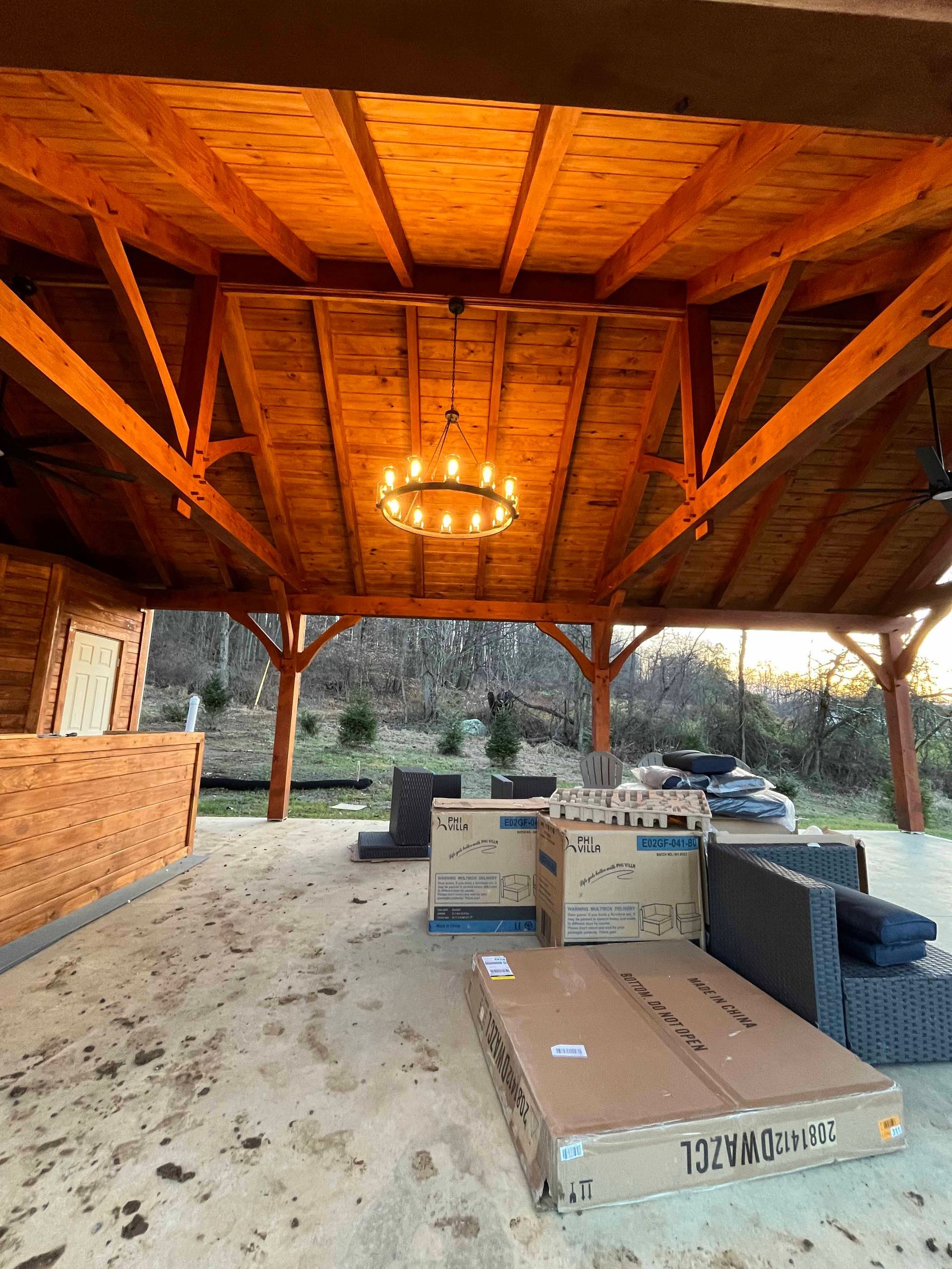 A wooden structure with a chandelier hanging from the ceiling