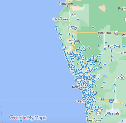 This is a Google My Maps screenshot showing a high density of blue markers clustered along Michigan areas.