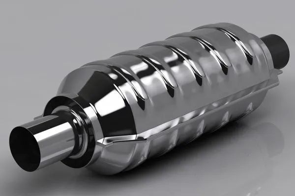 A silver, cylindrical metallic catalytic converter shown at an angle against a light gray background.