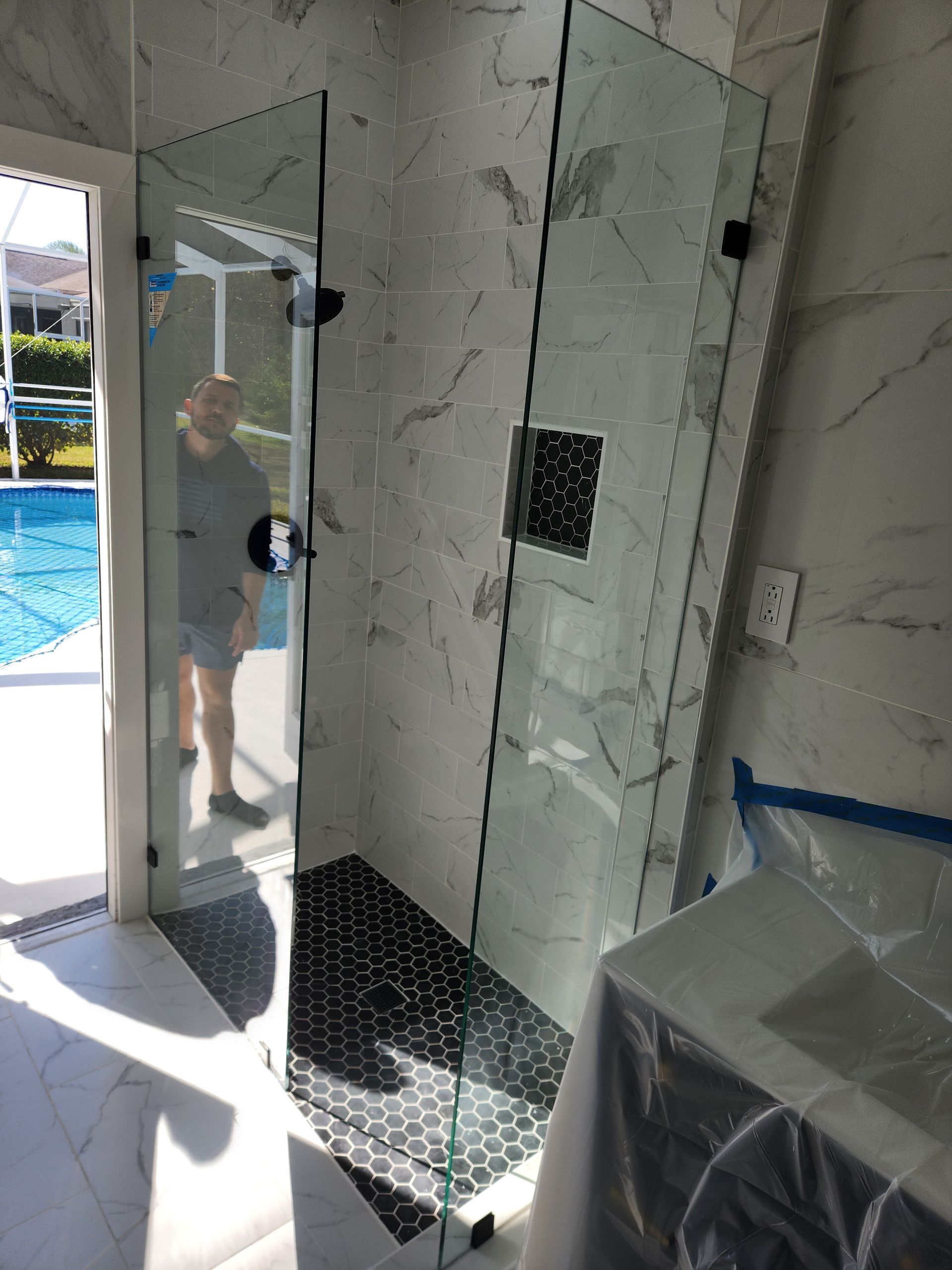 Shower glass with clear glass matte black clamps