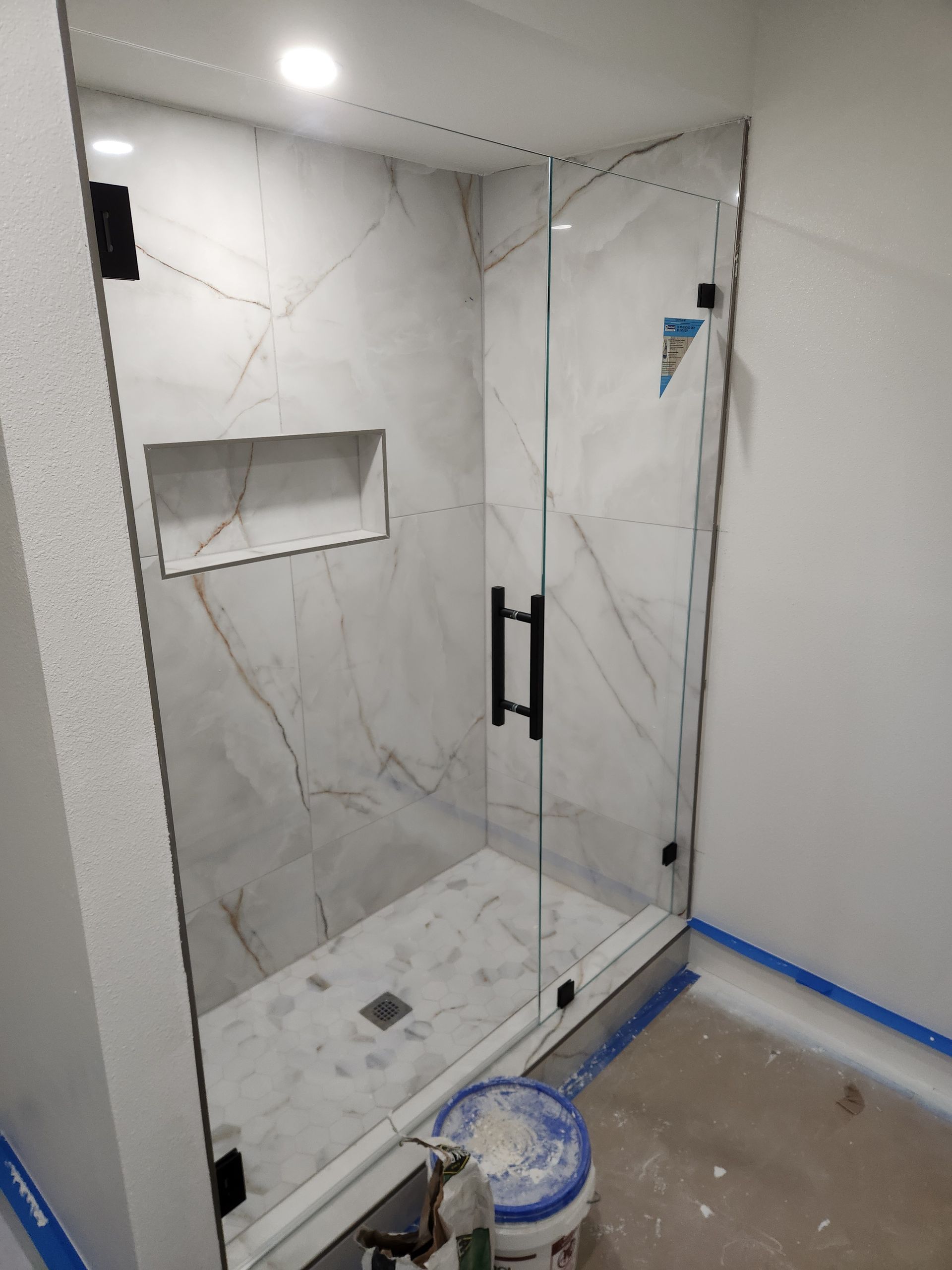 3/8 inch low iron glass with matte black clamps