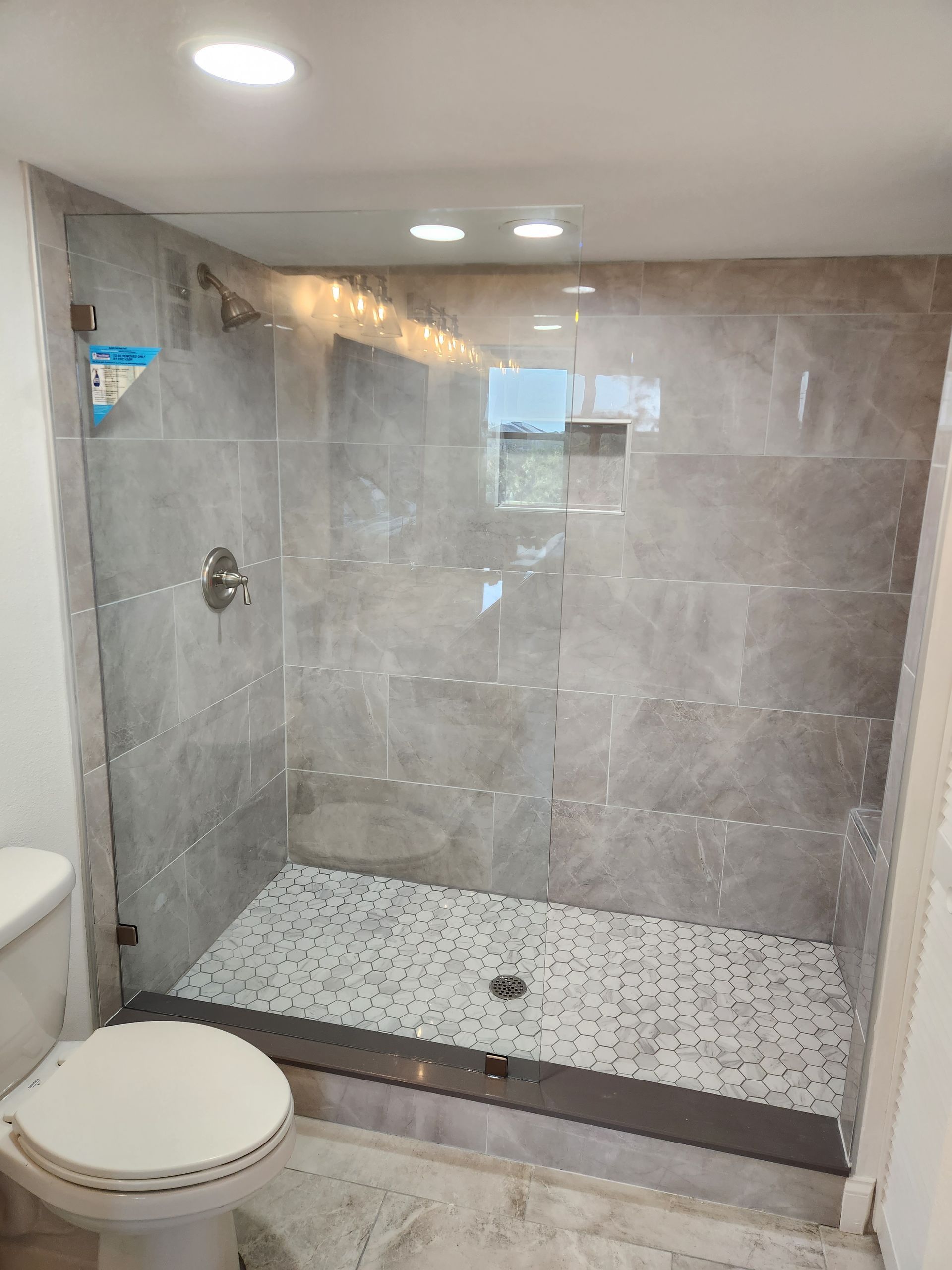 Clear glass with brushed nickel clamps