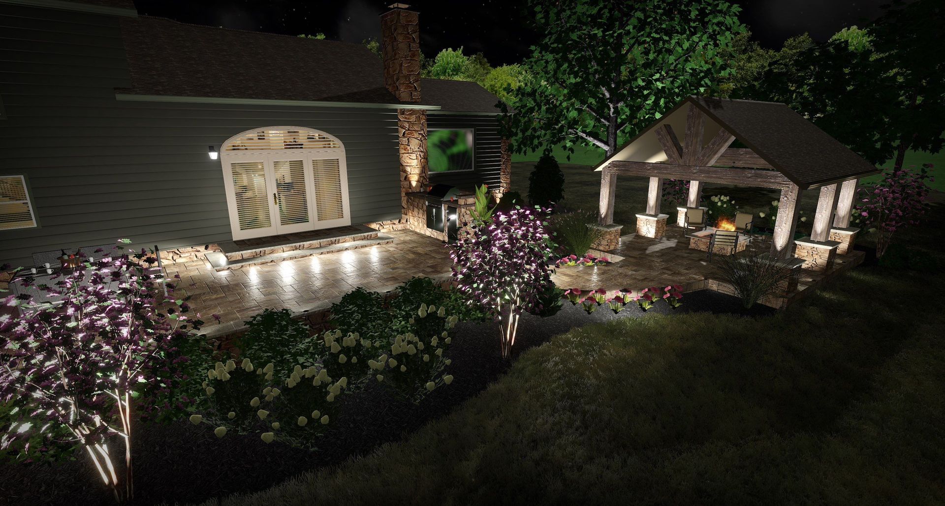 Illuminated garden patio at night with flowering trees, stone path, and a lit gazebo beside a house