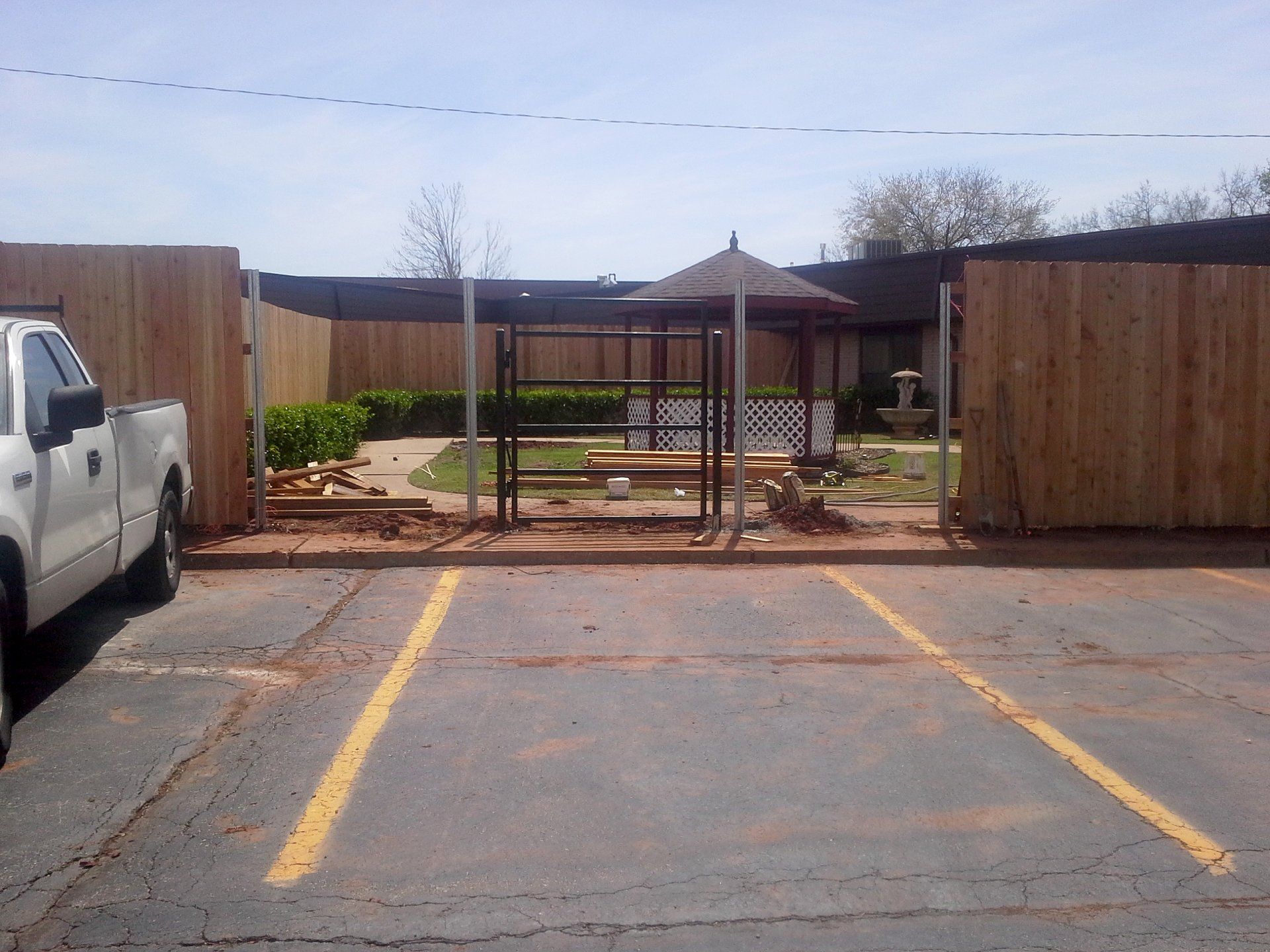 A white truck is parked in a parking lot