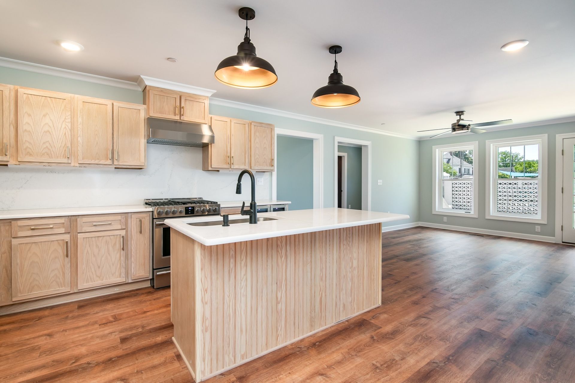 There is a large island in the middle of the kitchen.