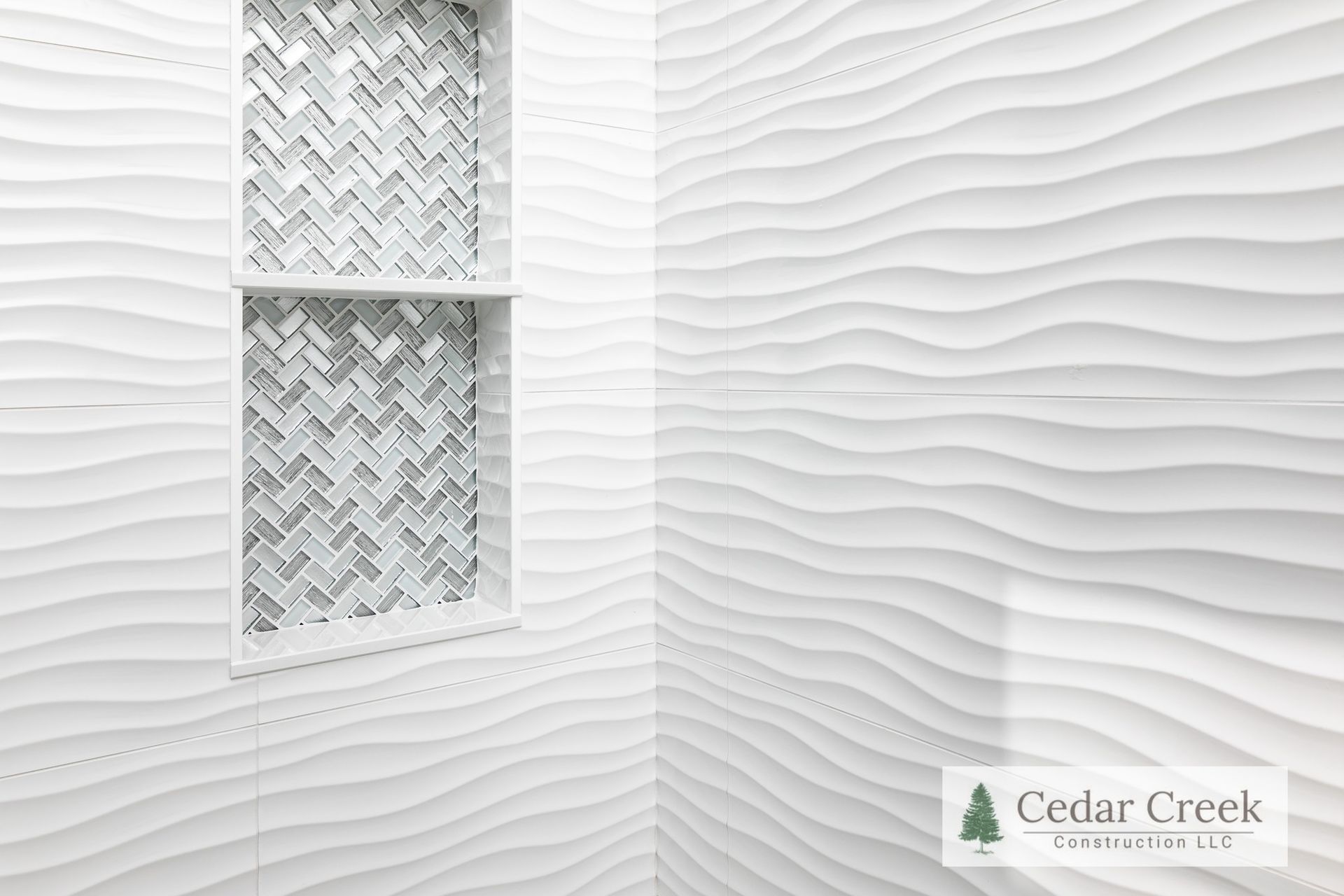 A bathroom with a white wall