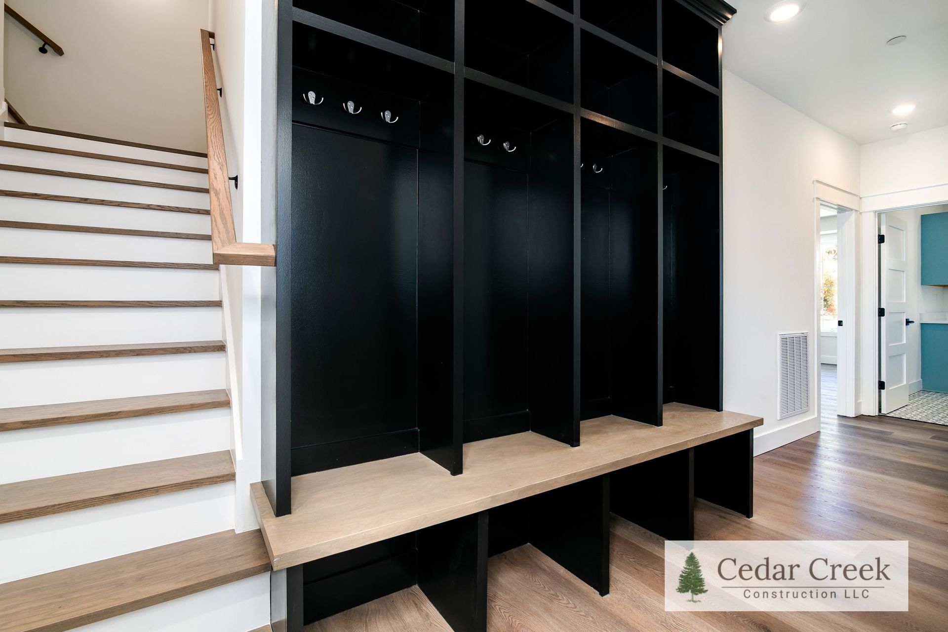 There is a bench in the middle of the room next to the stairs