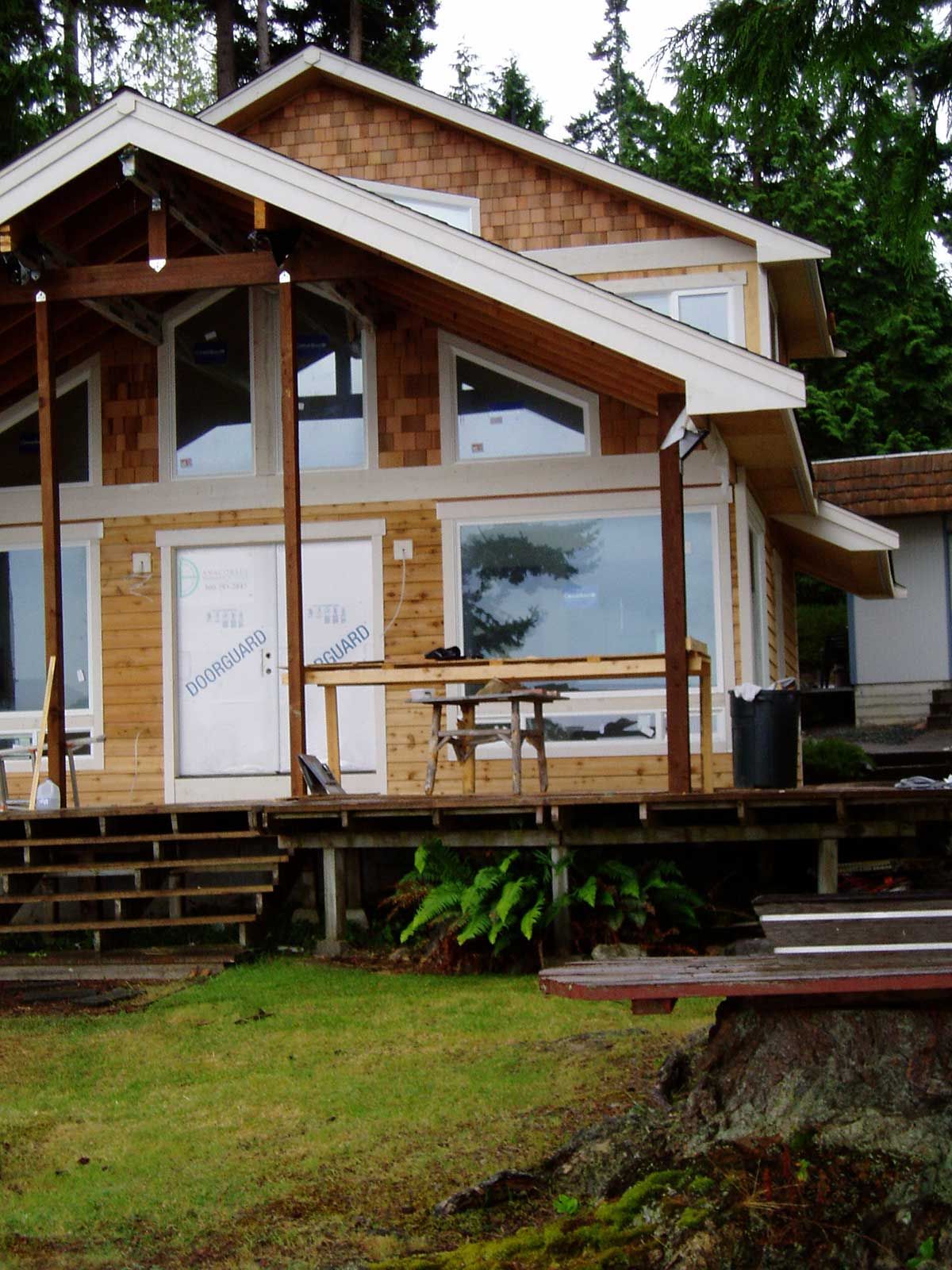 A house with a large porch and a table and chairs on it