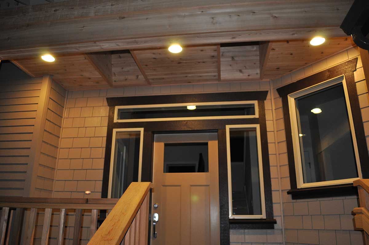 The front door of a house with stairs leading up to it