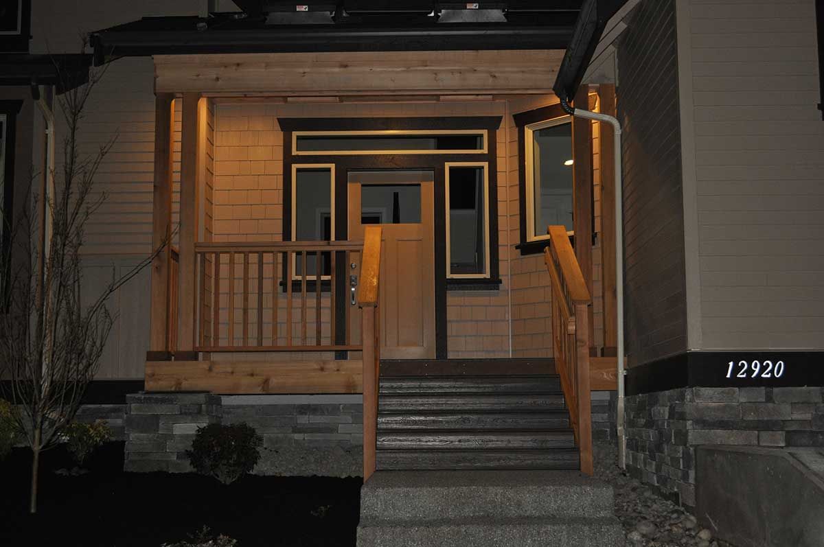 The front of a house with a porch and stairs
