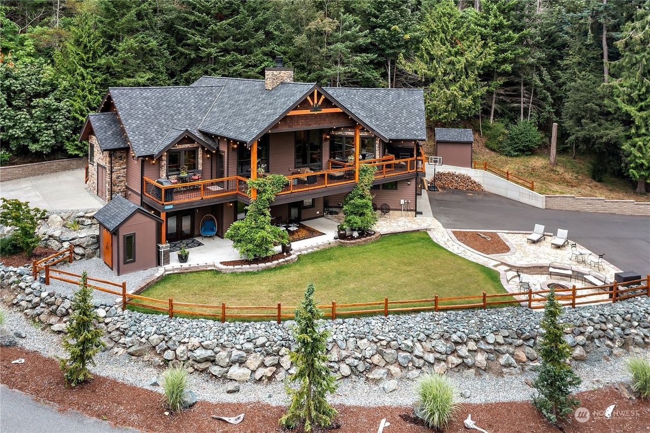 An aerial view of a large house surrounded by trees.