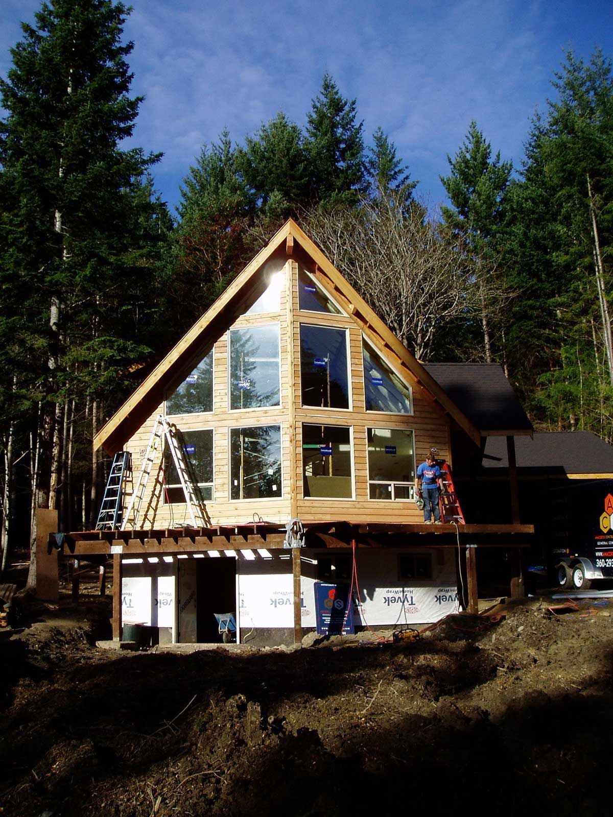 A large house with a lot of windows is being built
