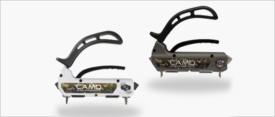Two black-and-white camping knives with curved handles, shown side by side on a white background