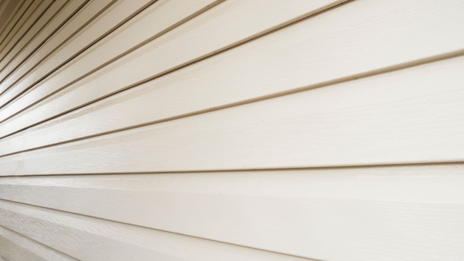 A close up of a white siding on a house